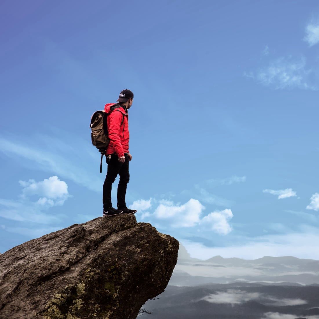Person looking into distance on mountain